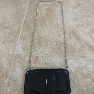 A small unique black shoulder bag perfect for everyday